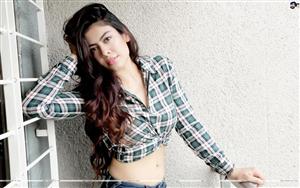 Anurita Jha flaunts her natural beauty in a check shirt